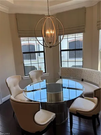 a living room with furniture a window and a table