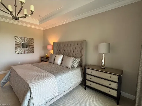 a bedroom with a bed and a night stand