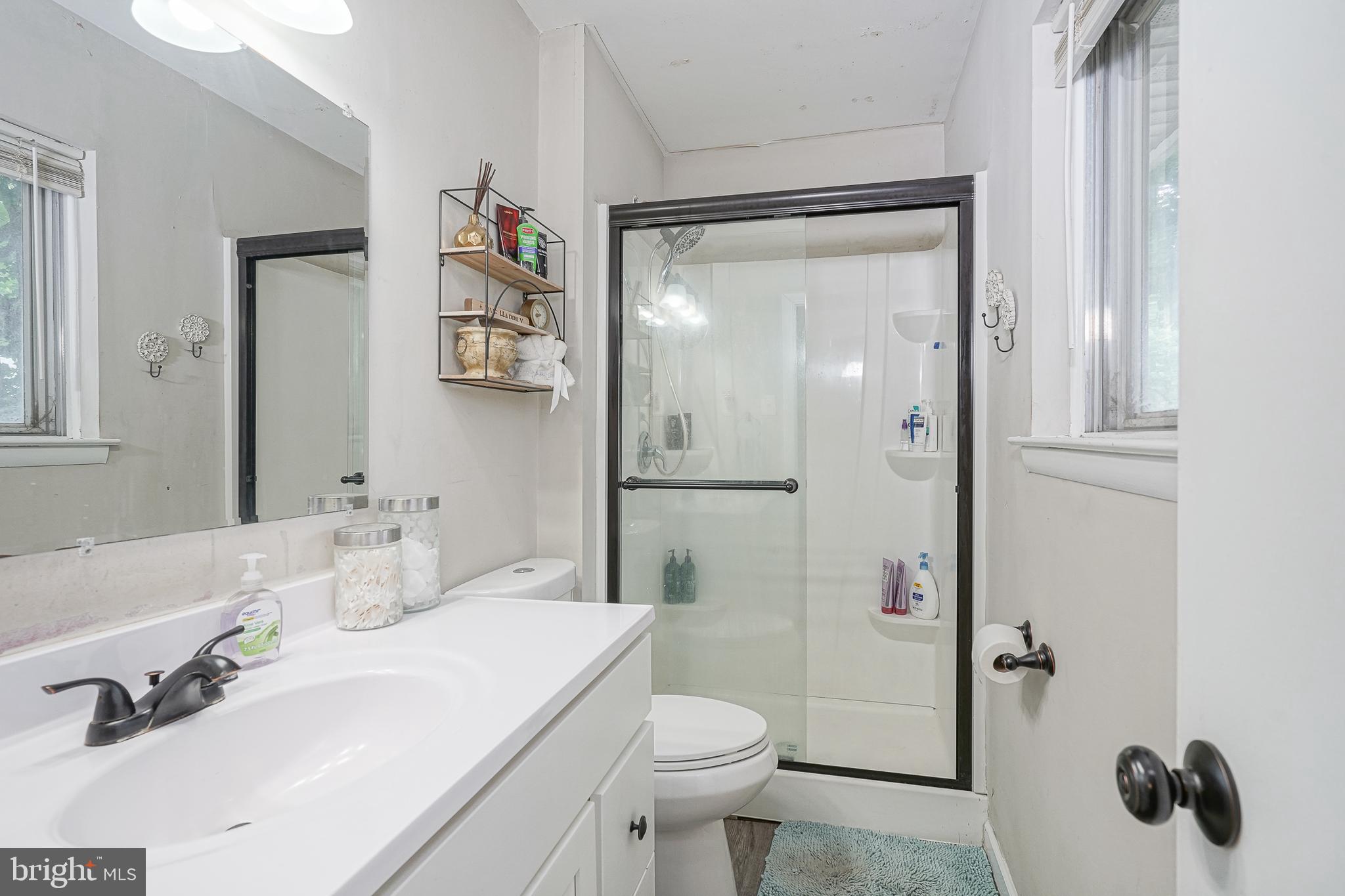 47 Bryant Road Blackwood, NJ 08012 - Photo 7 of 21 a bathroom with a sink a toilet and shower