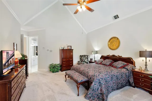 a spacious bathroom with a tub sink shower and mirror