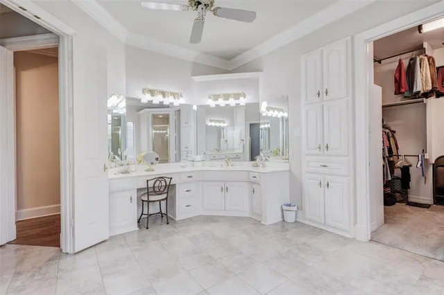 a spacious bathroom with a tub sink and mirror