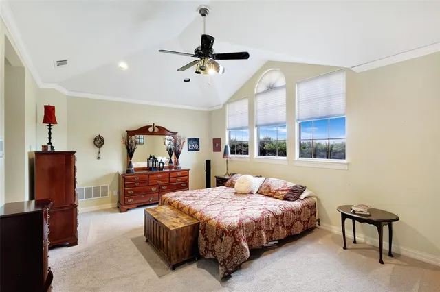 walk in closet with lots of frames on wall