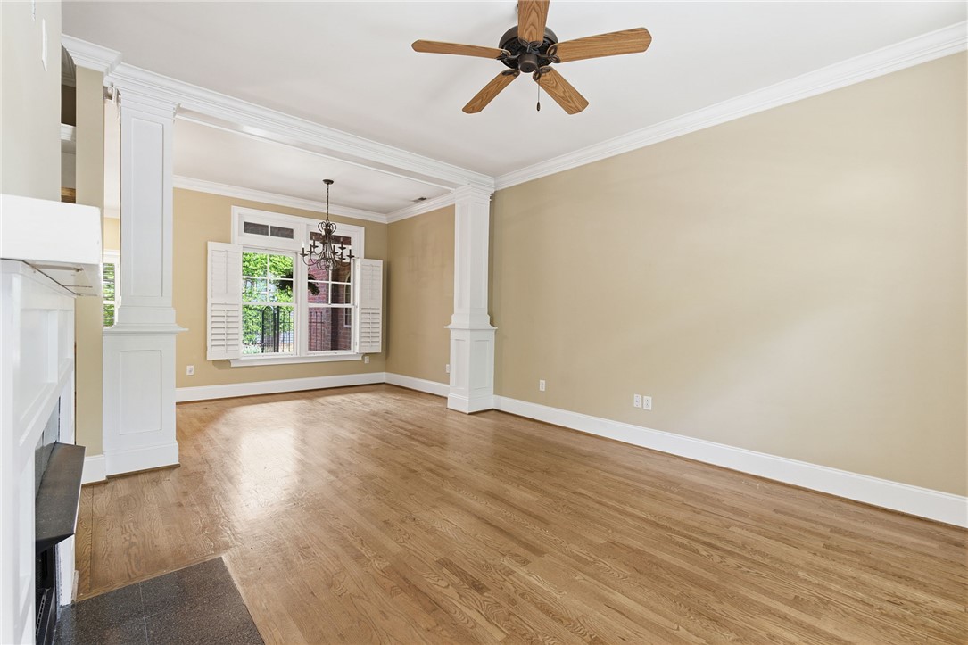 204 Butler Avenue Greenville, SC 29601 - Photo 9 of 26 Hardwood floors and crisp crown molding create a classic foundation for this spacious living area.