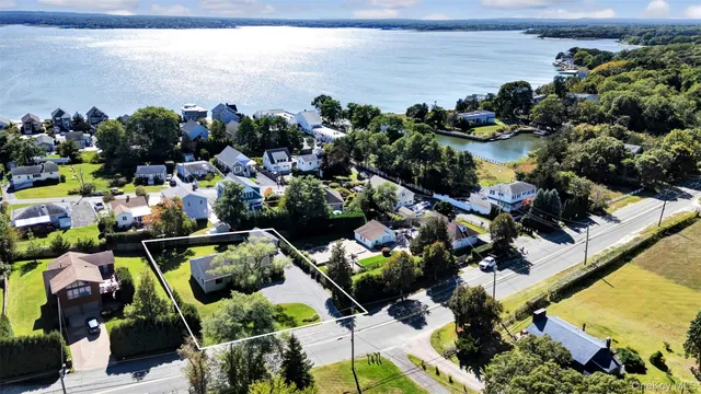a view of a lake with outdoor seating