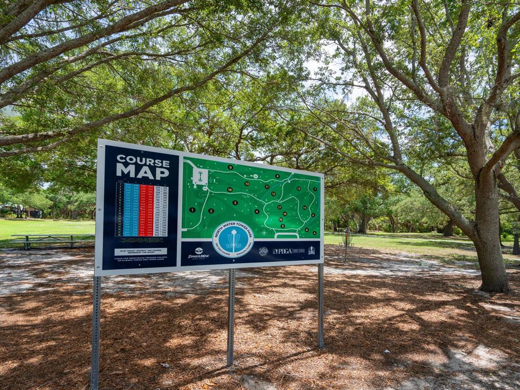 4805 Rilma Avenue, Unit 107 Sarasota, FL 34234 - Photo 41 of 42 a sign that is sitting on the side of a road