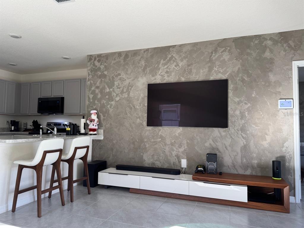 2843 Turnstone Run Harmony, FL 34773 - Photo 28 of 39 a living room with furniture and a fireplace