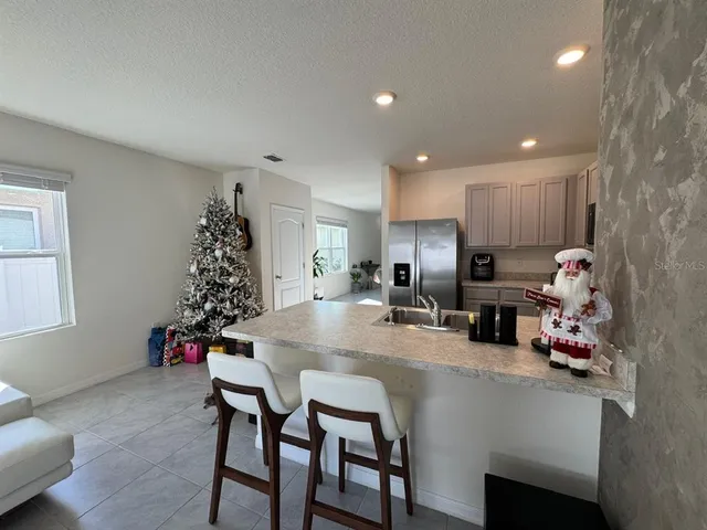 a kitchen with a table and chairs in it