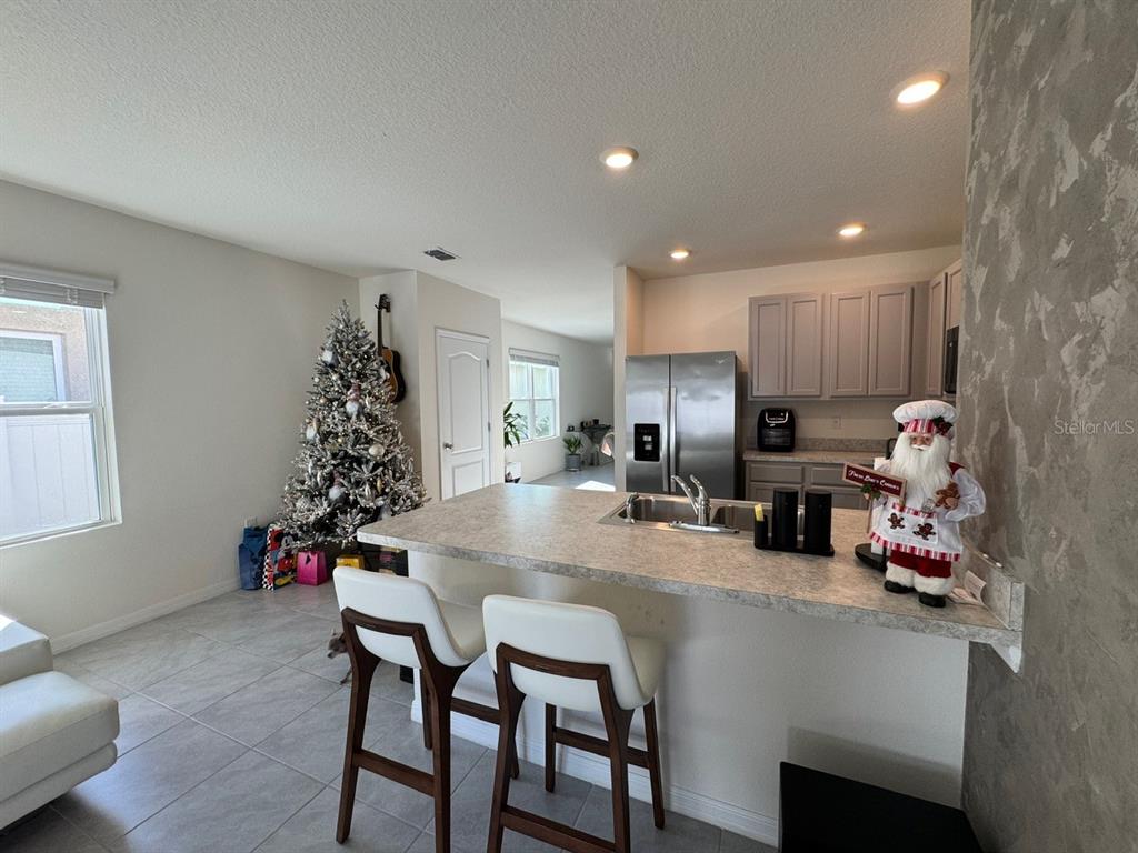 2843 Turnstone Run Harmony, FL 34773 - Photo 34 of 39 a kitchen with a table and chairs in it