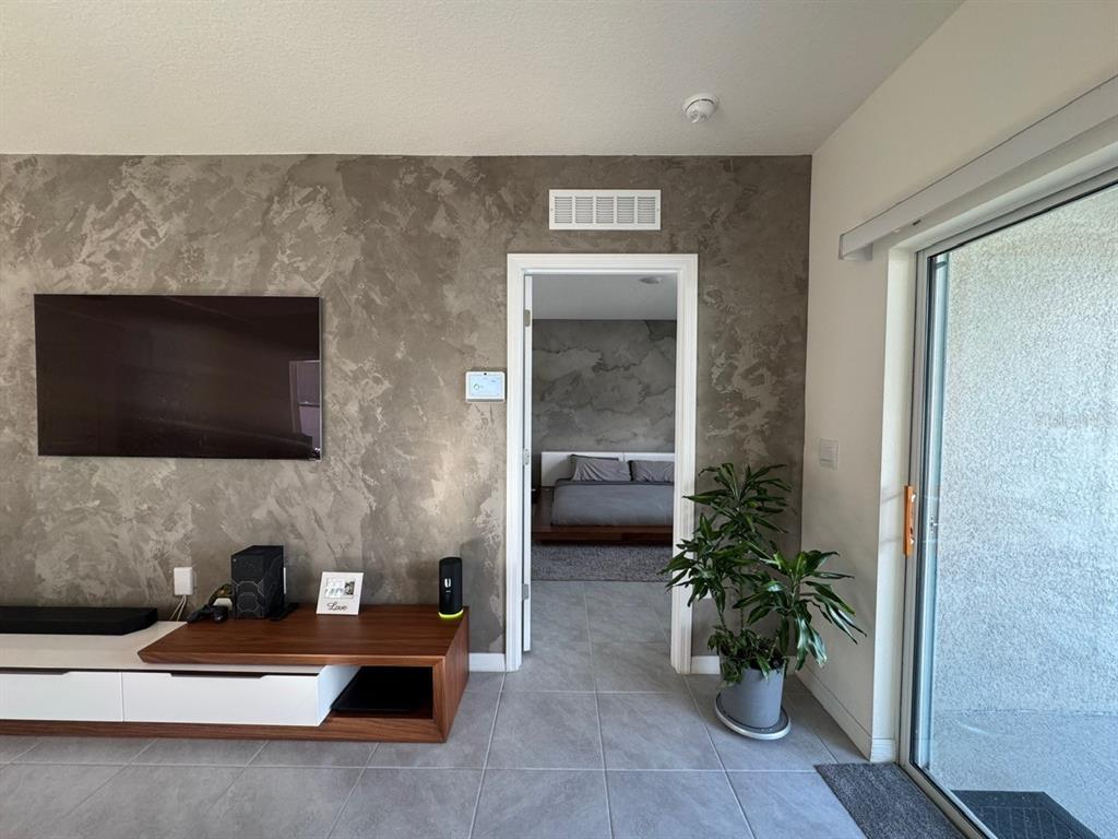 2843 Turnstone Run Harmony, FL 34773 - Photo 38 of 39 a living room with furniture and a potted plant