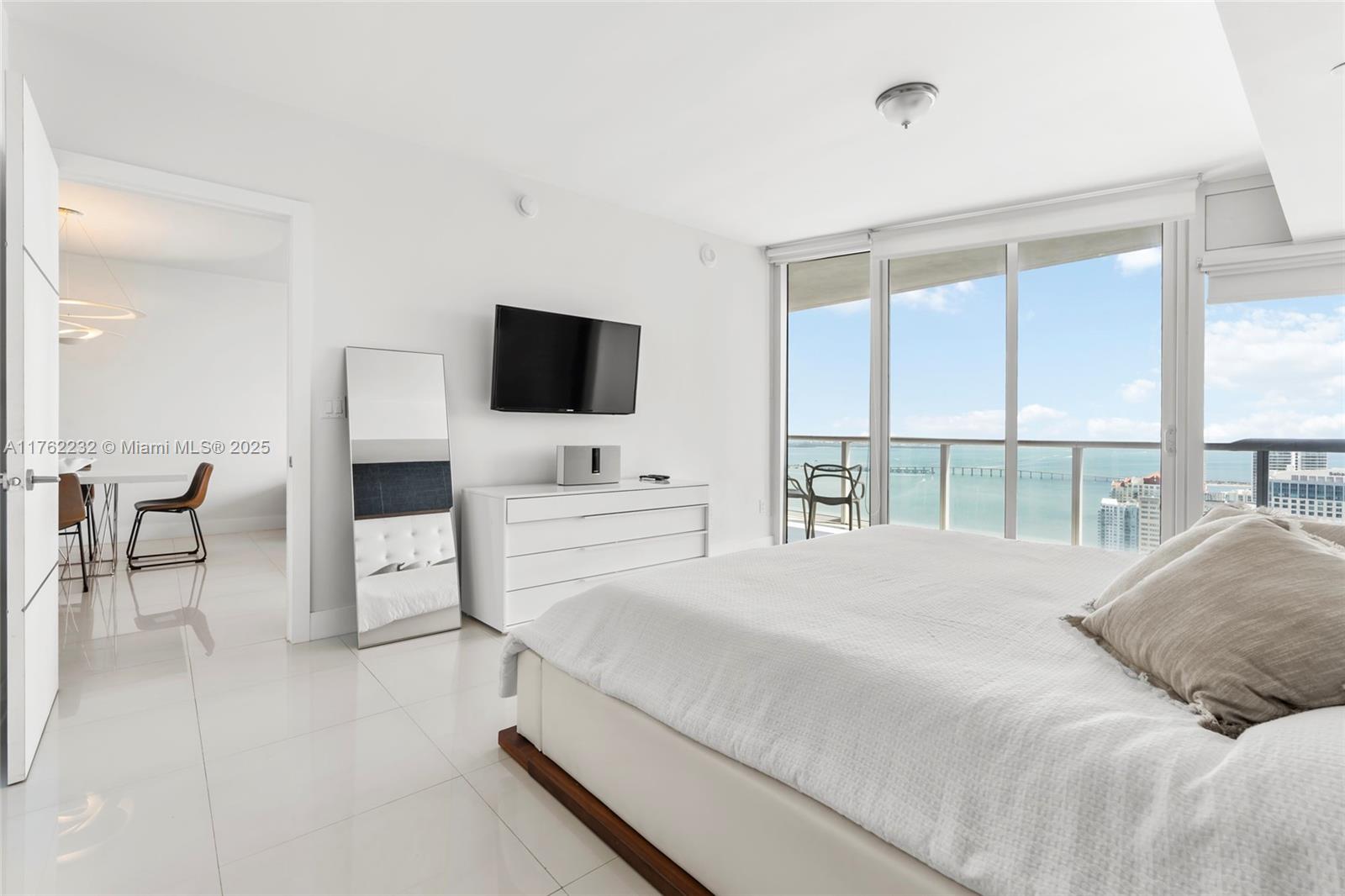 495 Brickell Avenue, Unit 4907 Miami, FL 33131 - Photo 24 of 65 a bedroom with a bed and a flat screen tv