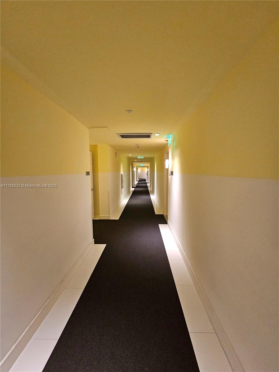 495 Brickell Avenue, Unit 4907 Miami, FL 33131 - Photo 5 of 65 a view of a hallway with wooden floor