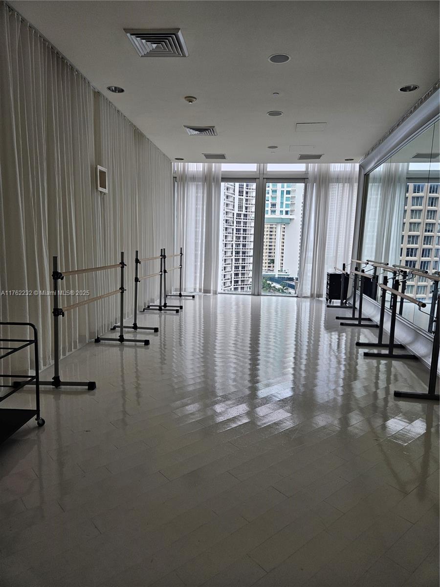 495 Brickell Avenue, Unit 4907 Miami, FL 33131 - Photo 54 of 65 a view of an empty room with glass door