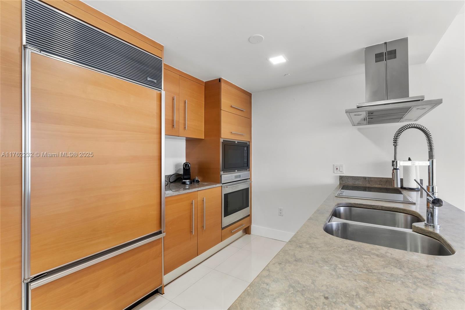 495 Brickell Avenue, Unit 4907 Miami, FL 33131 - Photo 8 of 65 a kitchen with stainless steel appliances granite countertop a refrigerator and a sink