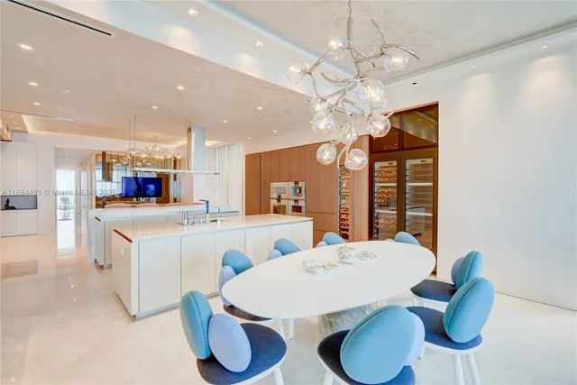 a bathroom with a tub double vanity sink and mirror