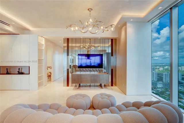 a large kitchen with kitchen island a sink a counter space and stainless steel appliances