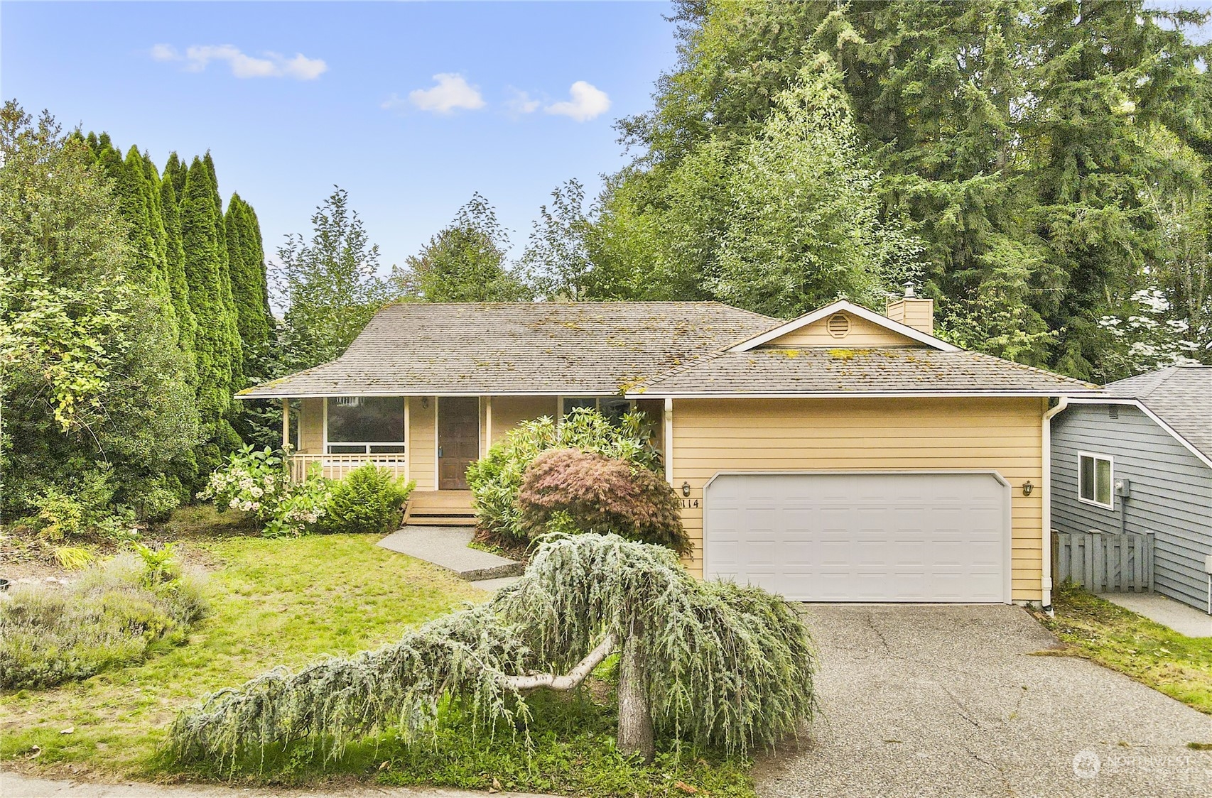 1114 232nd Place Southwest Bothell, WA 98021 - Photo 1 of 1 a front view of a house with garden