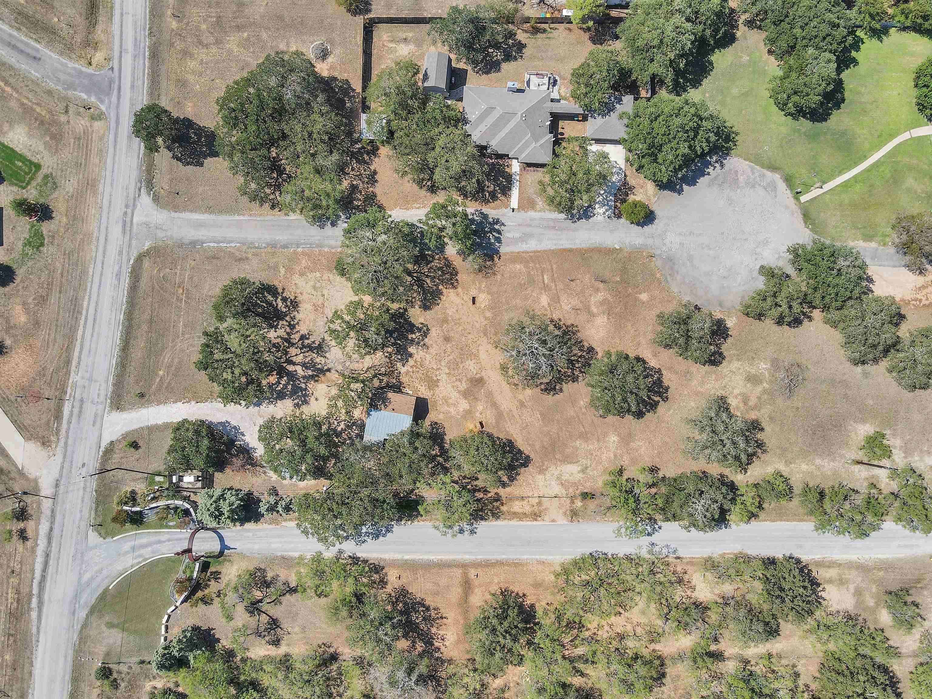 314 Camp Road Marble Falls, TX 78654 - Photo 3 of 7 an aerial view of a house with a yard covered with snow