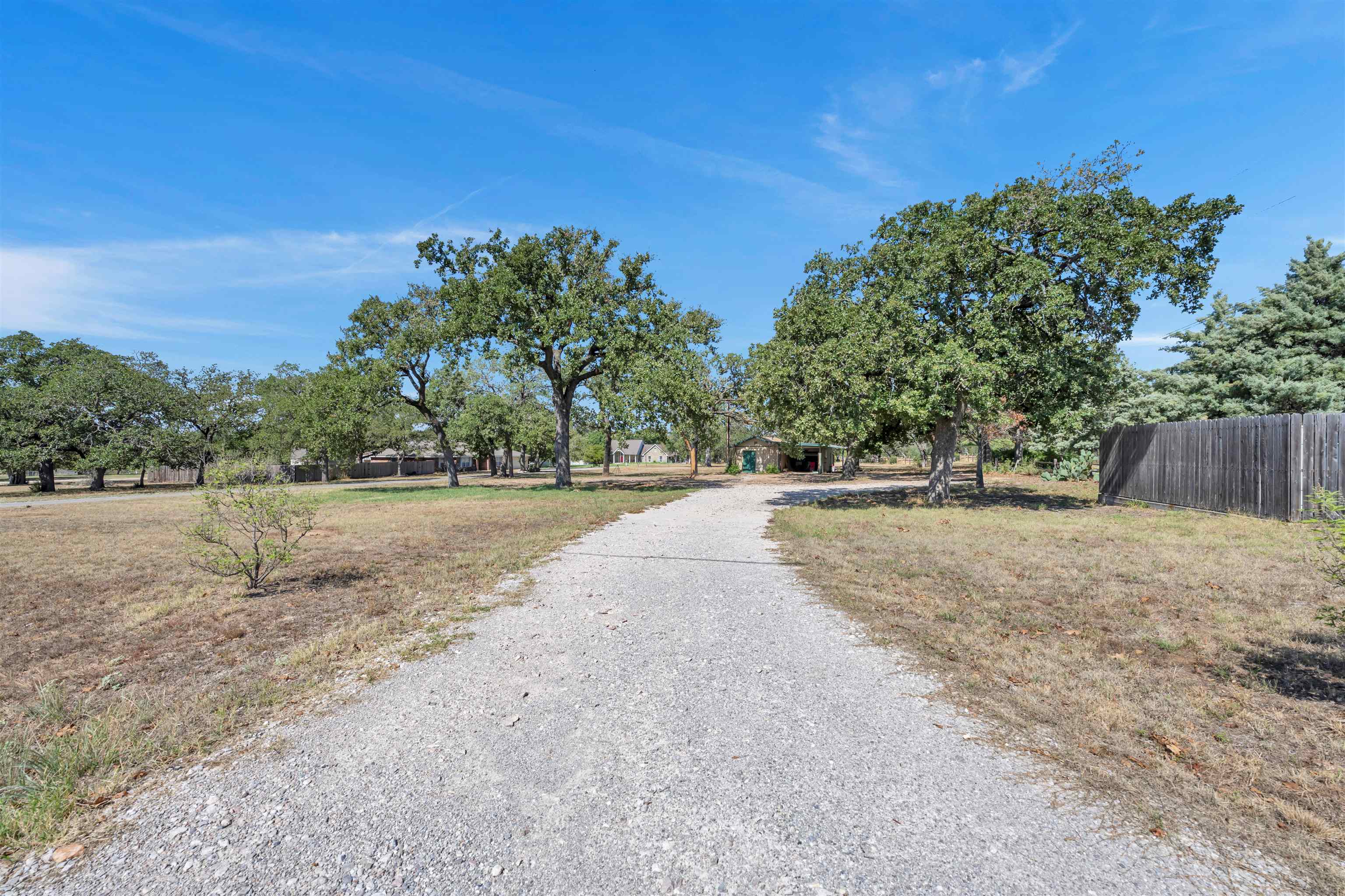 314 Camp Road Marble Falls, TX 78654 - Photo 6 of 7 a view of road with a yard
