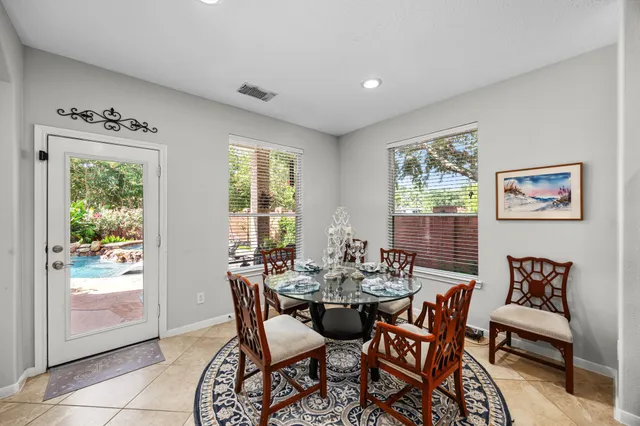 a dining room with furniture and window