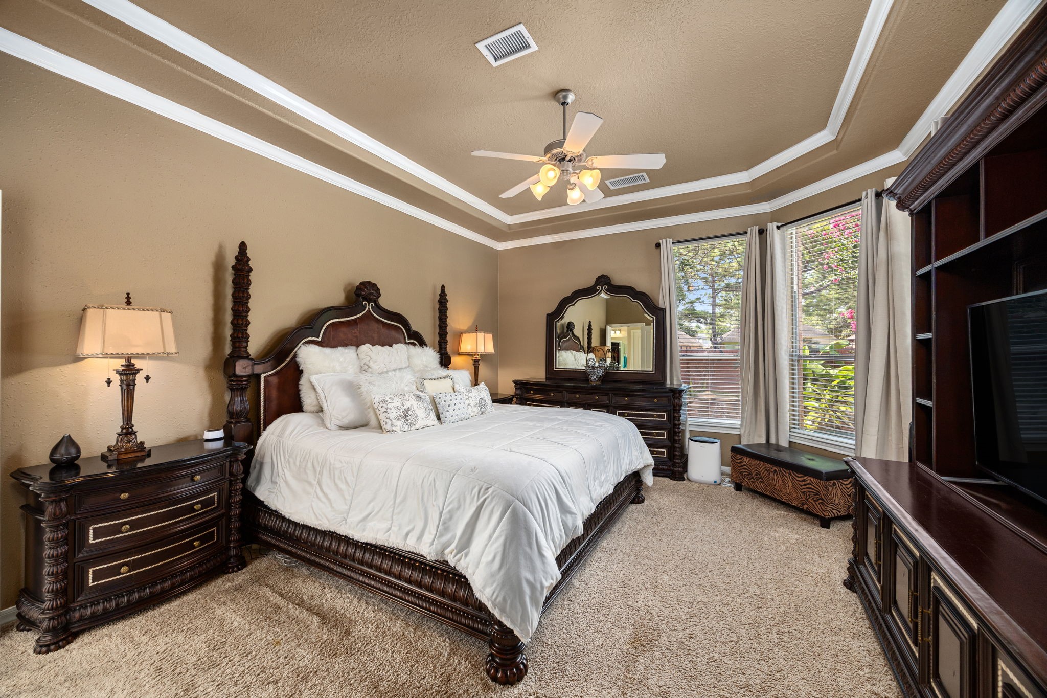 4402 Eden Point Lane Katy, TX 77494 - Photo 18 of 43 a bedroom with a bed and a flat tv screen on dresser