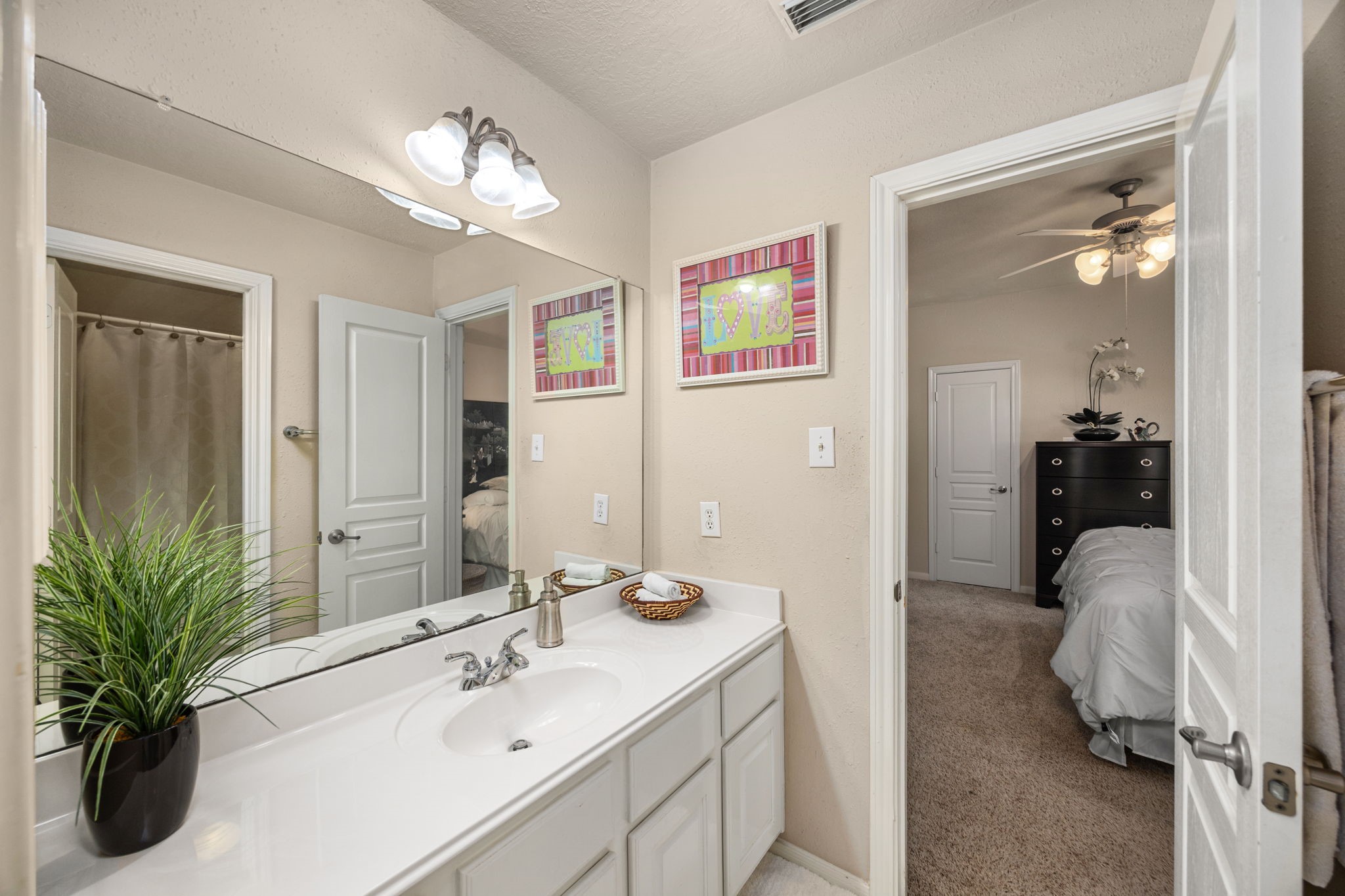 4402 Eden Point Lane Katy, TX 77494 - Photo 28 of 43 a en suite bathroom with a sink double vanity granite and a mirror