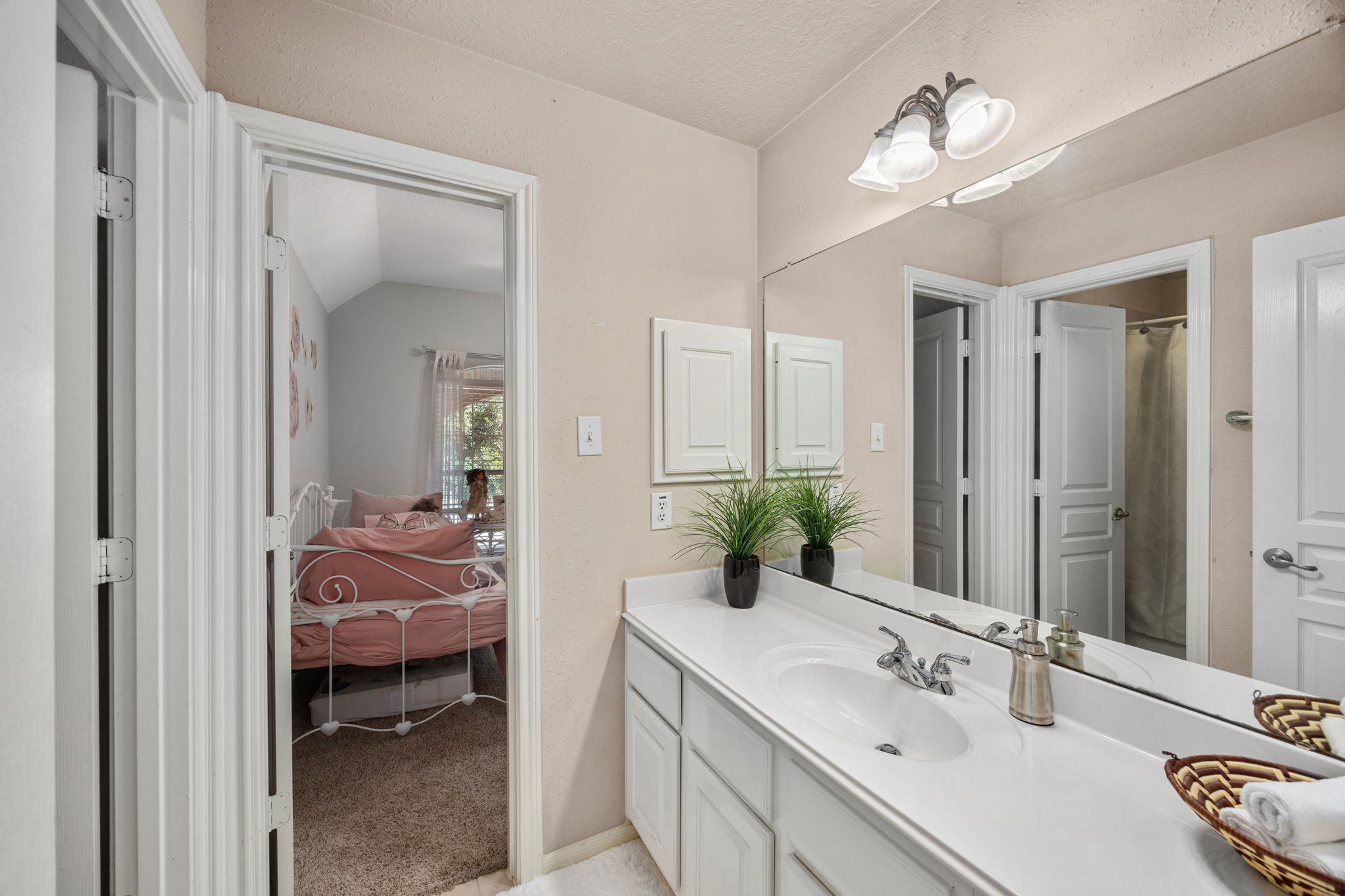 4402 Eden Point Lane Katy, TX 77494 - Photo 31 of 43 a en suite bathroom with a double vanity sink and a mirror