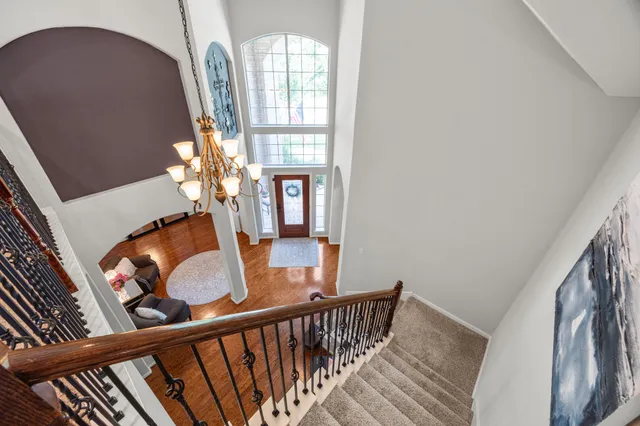 a view of a balcony with furniture and chandelier