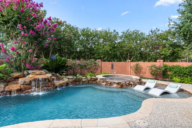 a view of a house with a yard and sitting area
