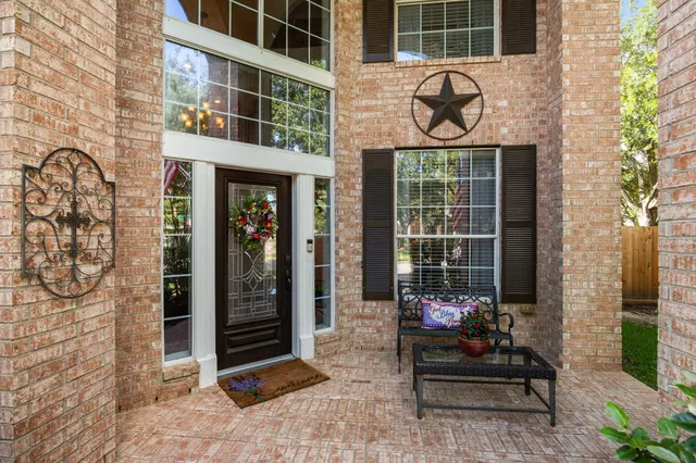 a front view of a building with glass windows and door