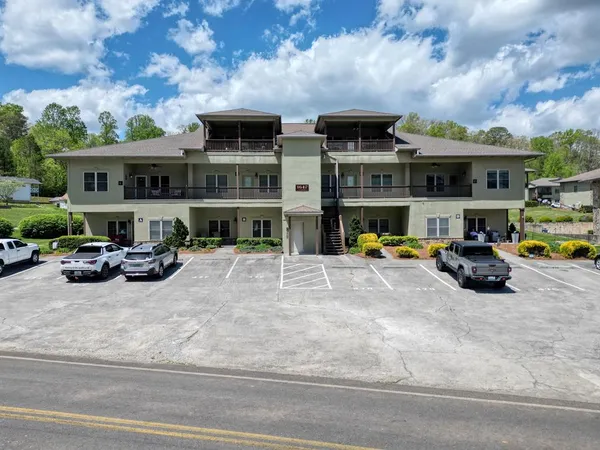 a view of a car park in front of house
