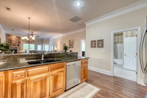 a kitchen with a refrigerator and cabinets