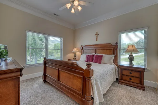a bed room with a bed and a night stand