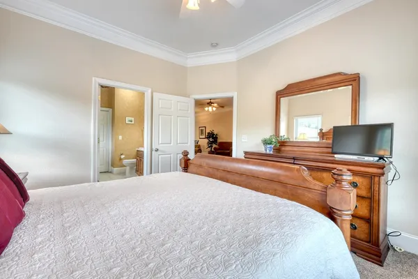 a bathroom with a double vanity sink mirror and toilet