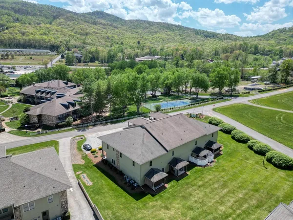 an aerial view of a house with a garden