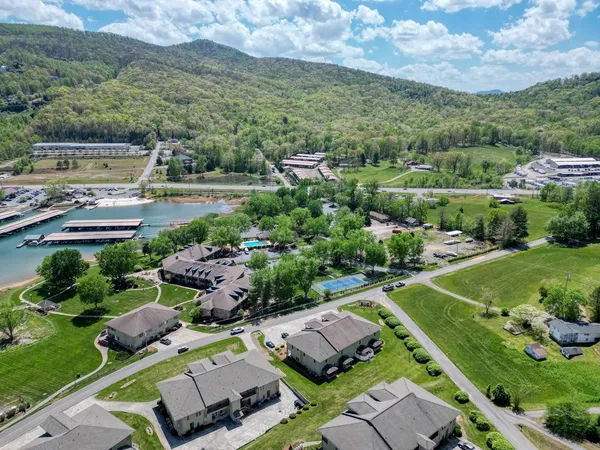 an aerial view of a house with a lake view