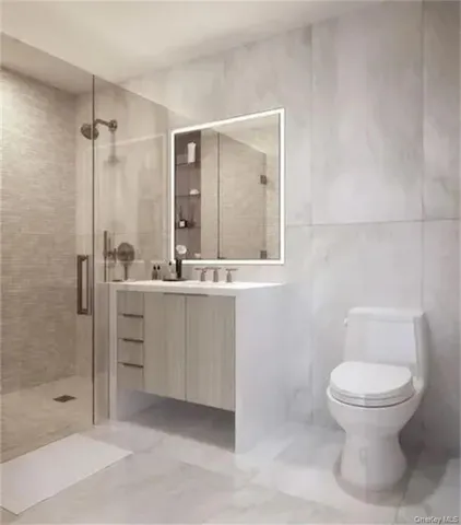 a bathroom with a toilet sink and shower