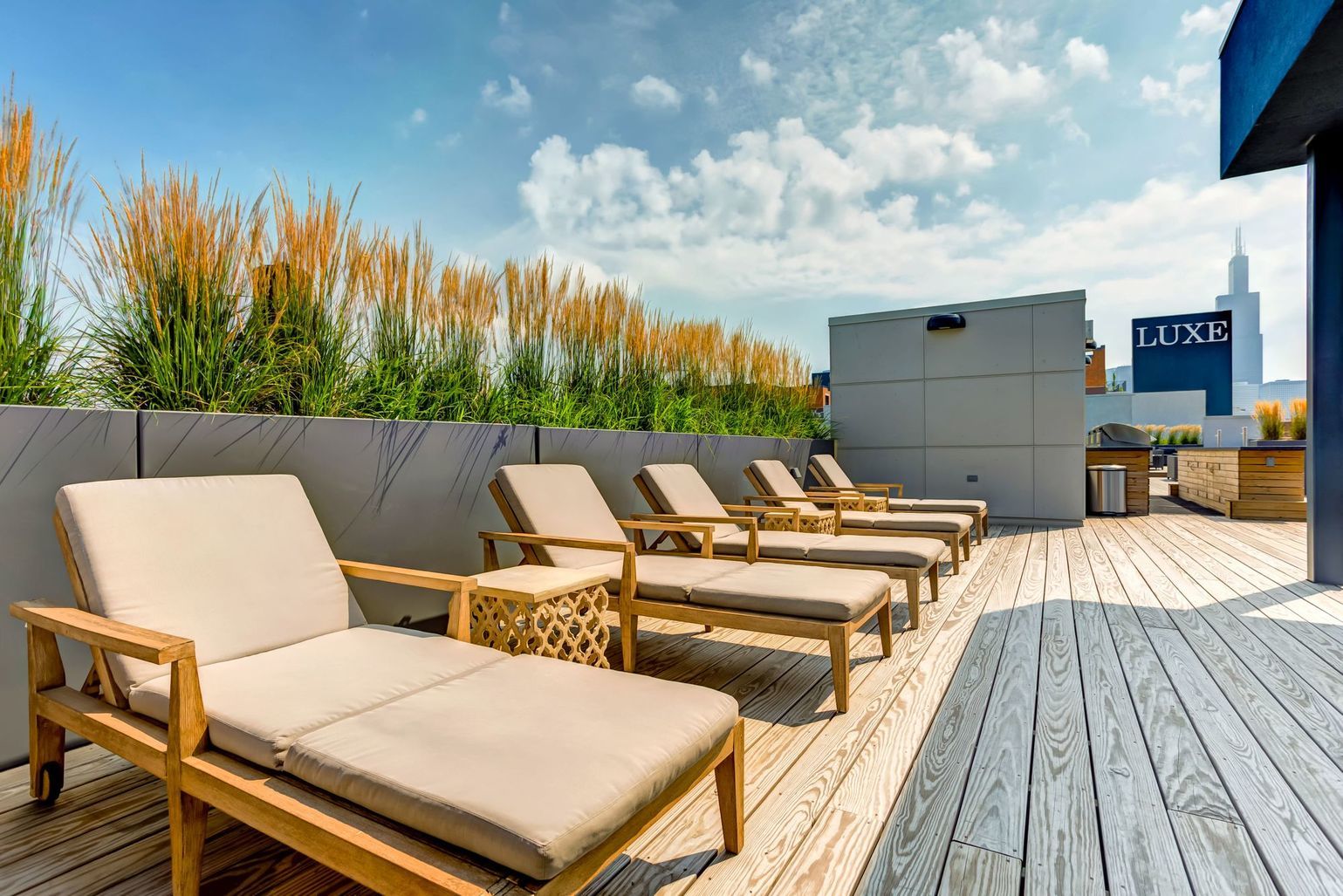 1222 West Madison Street, Unit 501 Chicago, IL 60607 - Photo 15 of 24 a terrace of a house with wooden floor outdoor seating and yard in the back