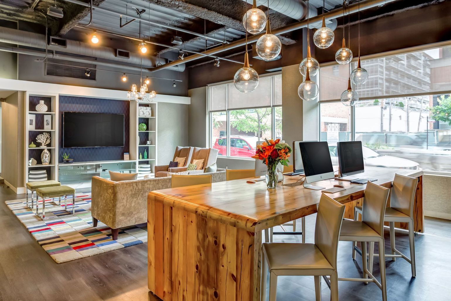 1222 West Madison Street, Unit 501 Chicago, IL 60607 - Photo 18 of 24 a living room with stainless steel appliances kitchen island granite countertop furniture and a flat screen tv