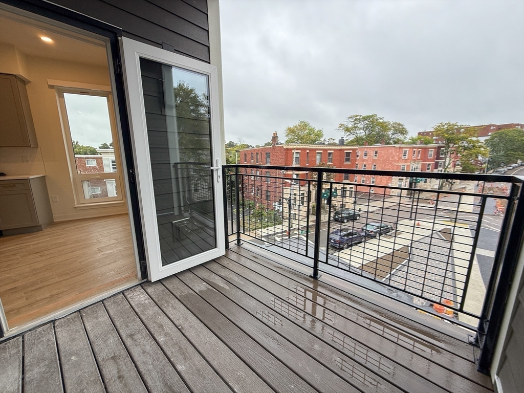 500 Talbot Avenue, Unit 308 Boston, MA 02124 - Photo 13 of 22 a view of balcony with wooden floor