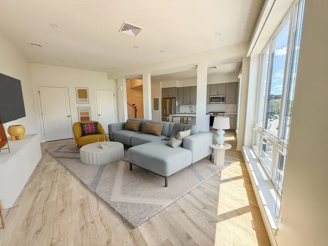 a bedroom with bed and a window