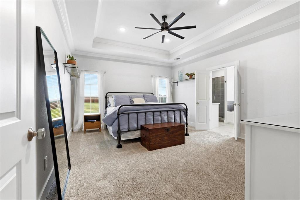 112 Chisolm Trail Pottsboro, TX 75076 - Photo 20 of 40 a bedroom with furniture and a large window