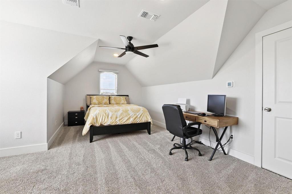 112 Chisolm Trail Pottsboro, TX 75076 - Photo 28 of 40 a bedroom with a bed a desk and chair