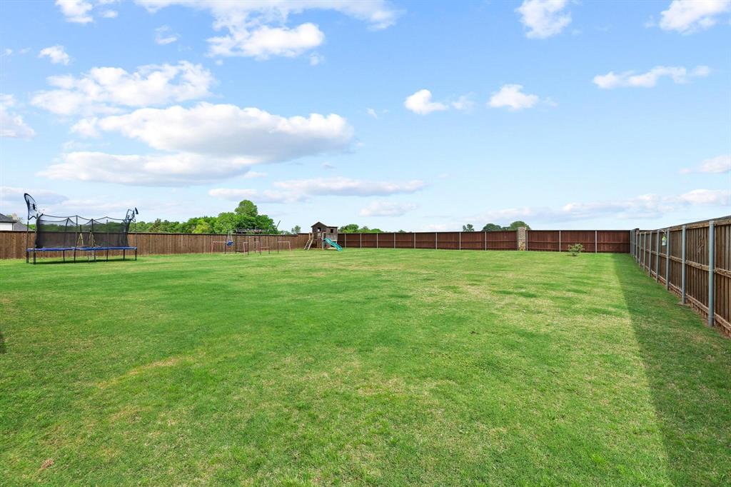 112 Chisolm Trail Pottsboro, TX 75076 - Photo 33 of 40 a view of a green field with clear sky