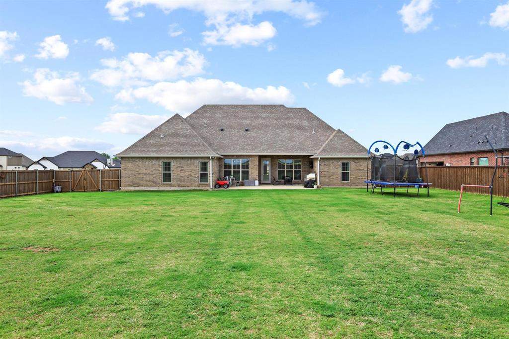 112 Chisolm Trail Pottsboro, TX 75076 - Photo 34 of 40 a view of a house with a big yard