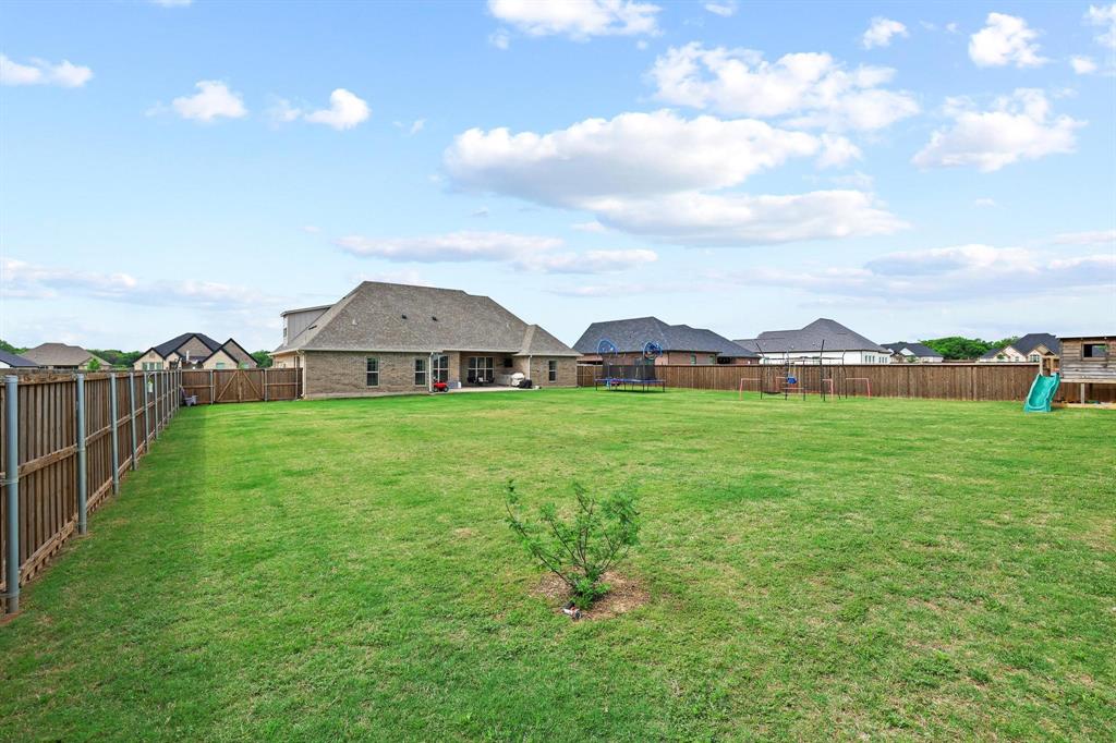 112 Chisolm Trail Pottsboro, TX 75076 - Photo 35 of 40 a view of a house with garden