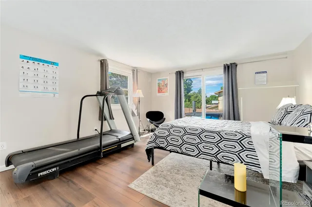 a bedroom with furniture and a window