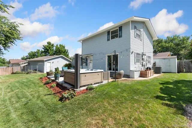a front view of house with yard and outdoor seating