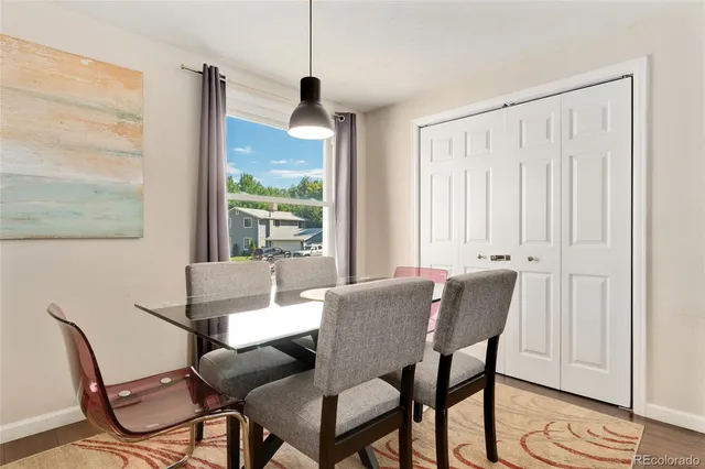 a view of a dining room with furniture window and wooden floor