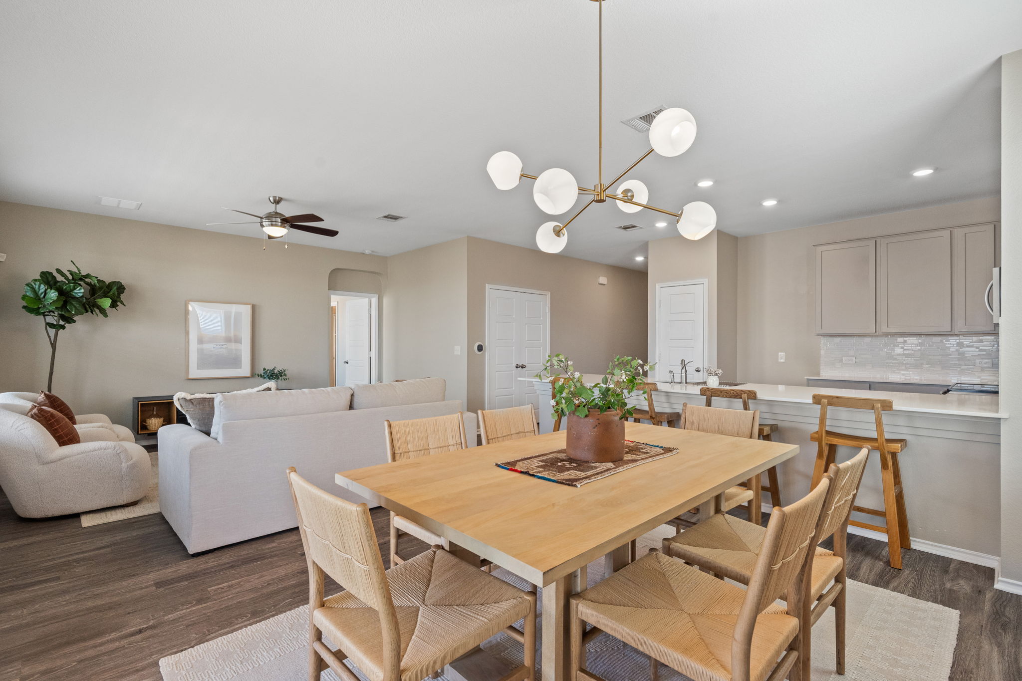 7504 Groundhog Way Austin, TX 78744 - Photo 6 of 22 a view of a dining room with furniture and wooden floor