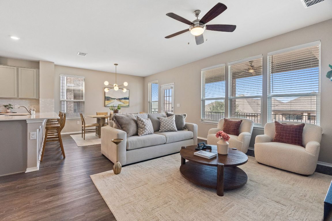 7504 Groundhog Way Austin, TX 78744 - Photo 7 of 22 The open layout is perfect for gathering with friends and family.